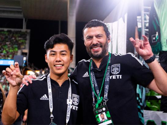 St. Edward's Alumni working at Austin FC pose and share Hilltop pride.