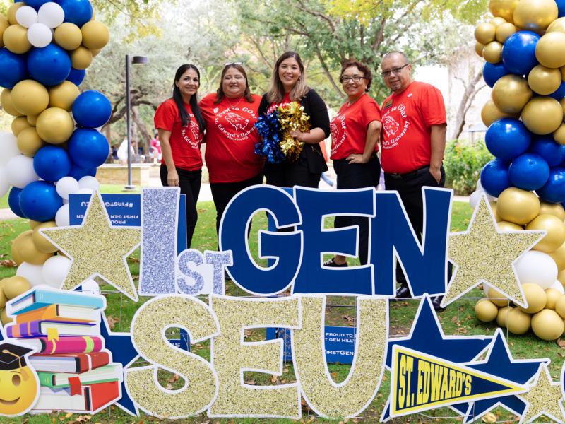 First-generation staff members pose for a photo on campus.