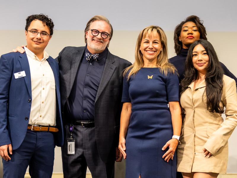 President Montserrat Fuentes joins the chancellor of Austin Community College and three transfer students for a group photo.