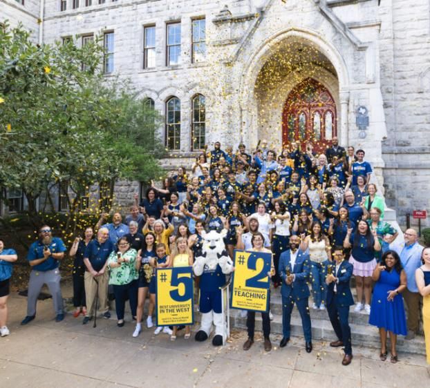 Students, Faculty and Staff on the main building steps to celebrate being placed 5 for USNWR.