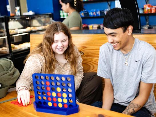 Students playing Connect 4