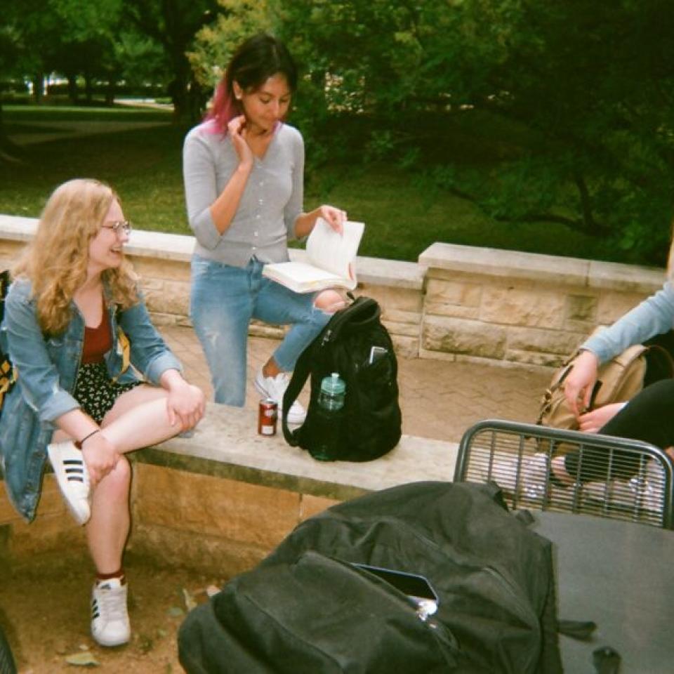 Friends hang out on the Ragsdale Patio.