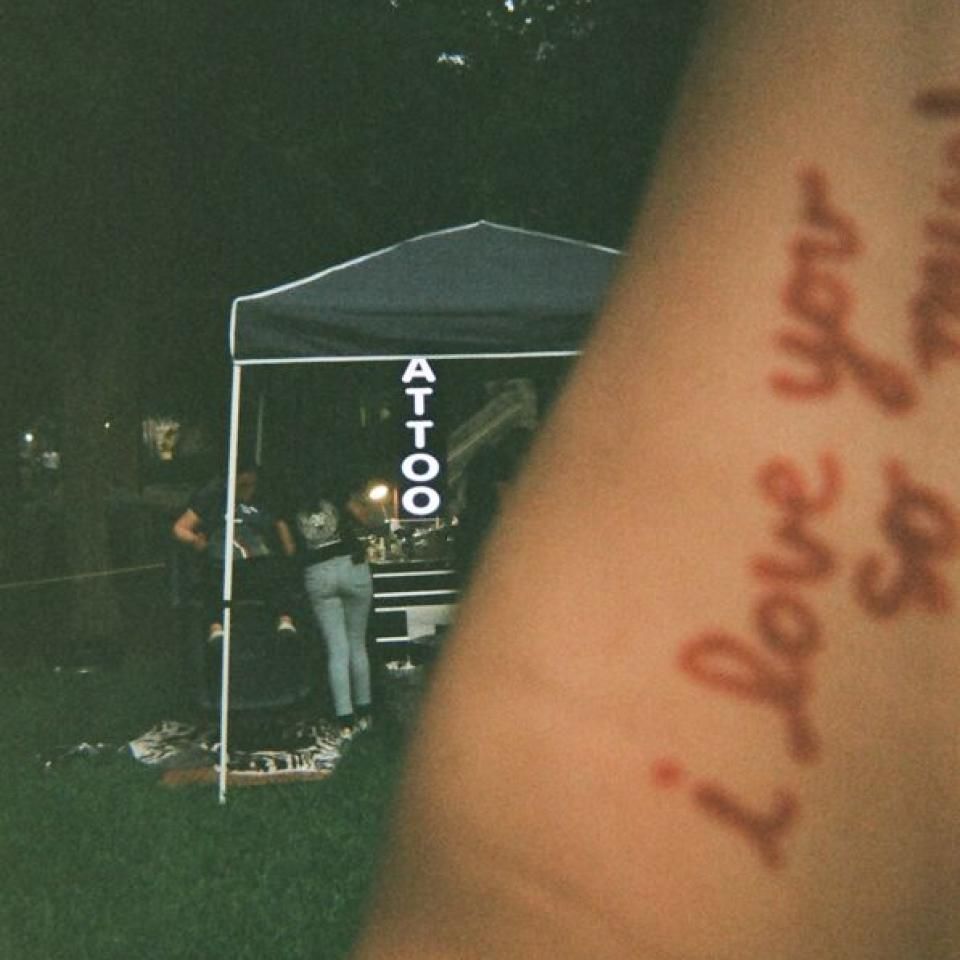 A temporary tatoo reads "i love you so much"