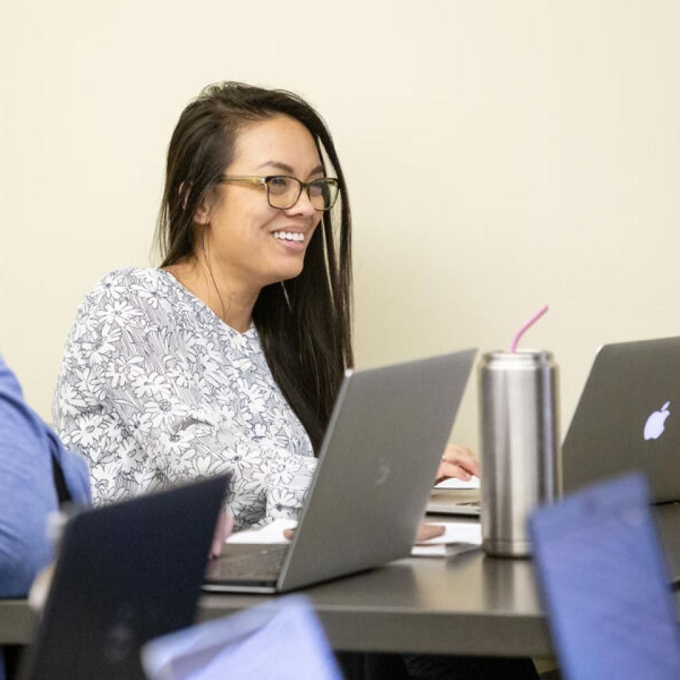 Student using her laptop in class.