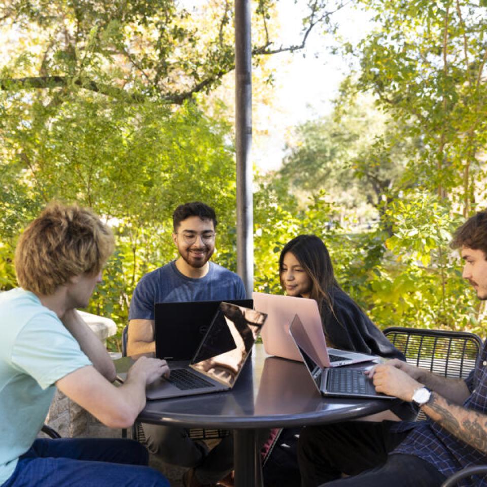 Sabur Khan studying with fellow students on campus