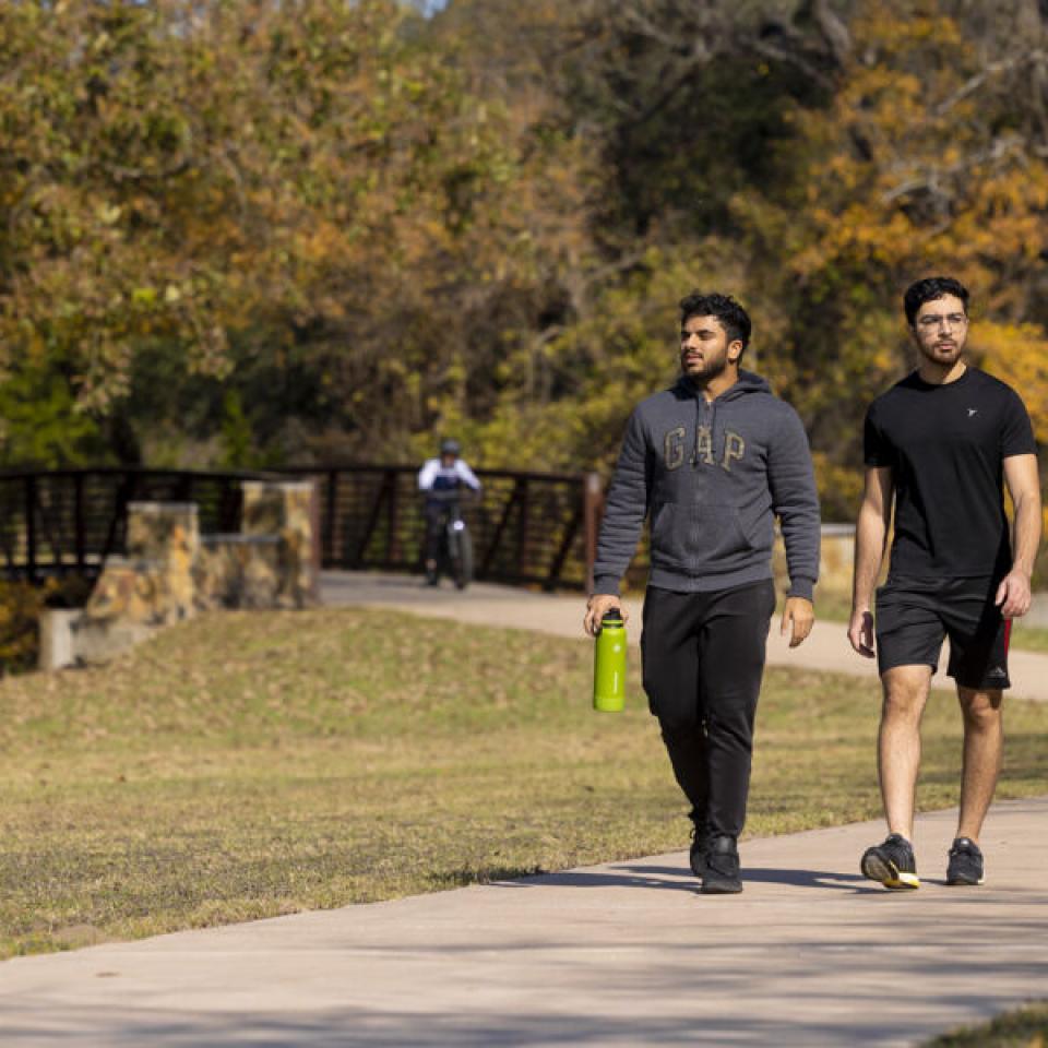 Sabur Khan walking with a friend