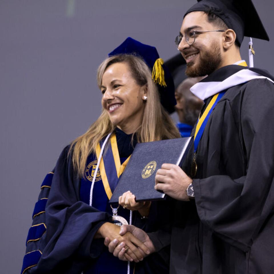 Sabur Khan with President Fuentes at graduation