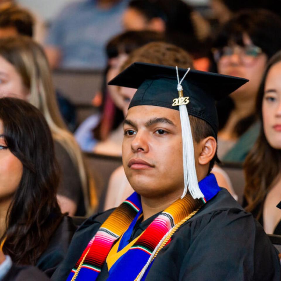 Camp student at graduation in cap and gown 