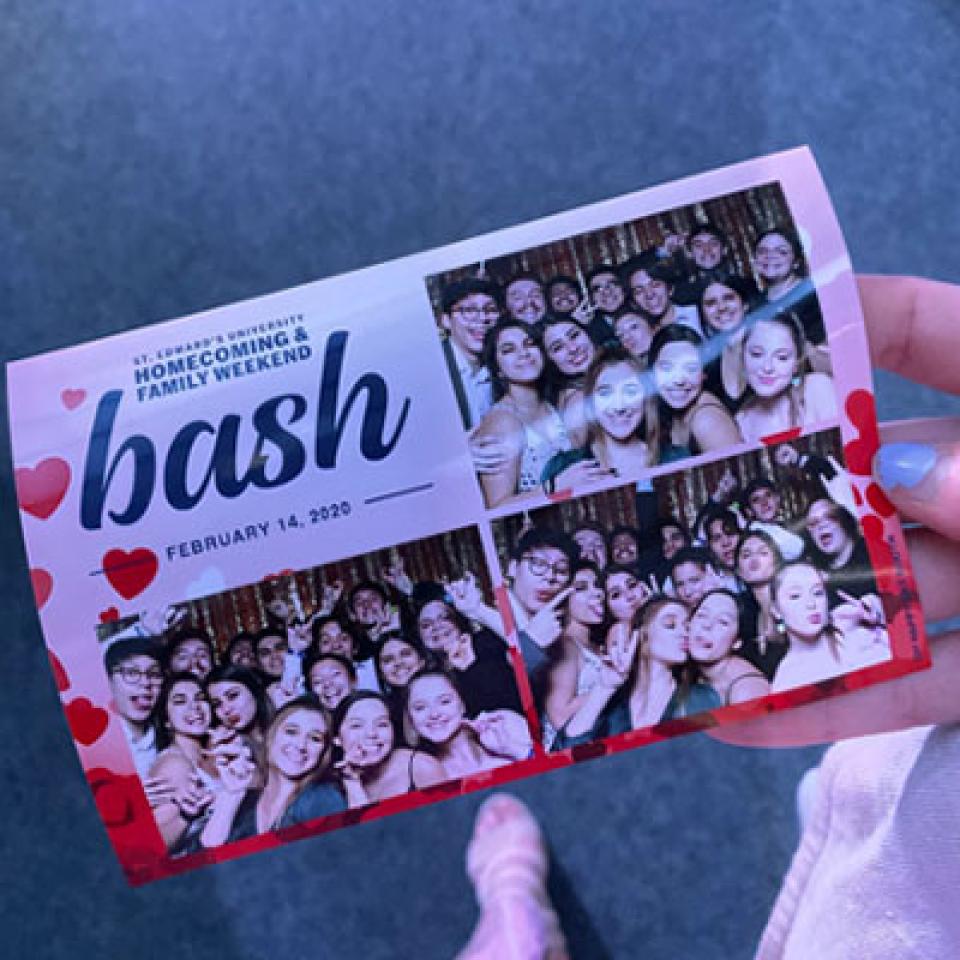 A photo booth picture of students from Homecoming Bash.