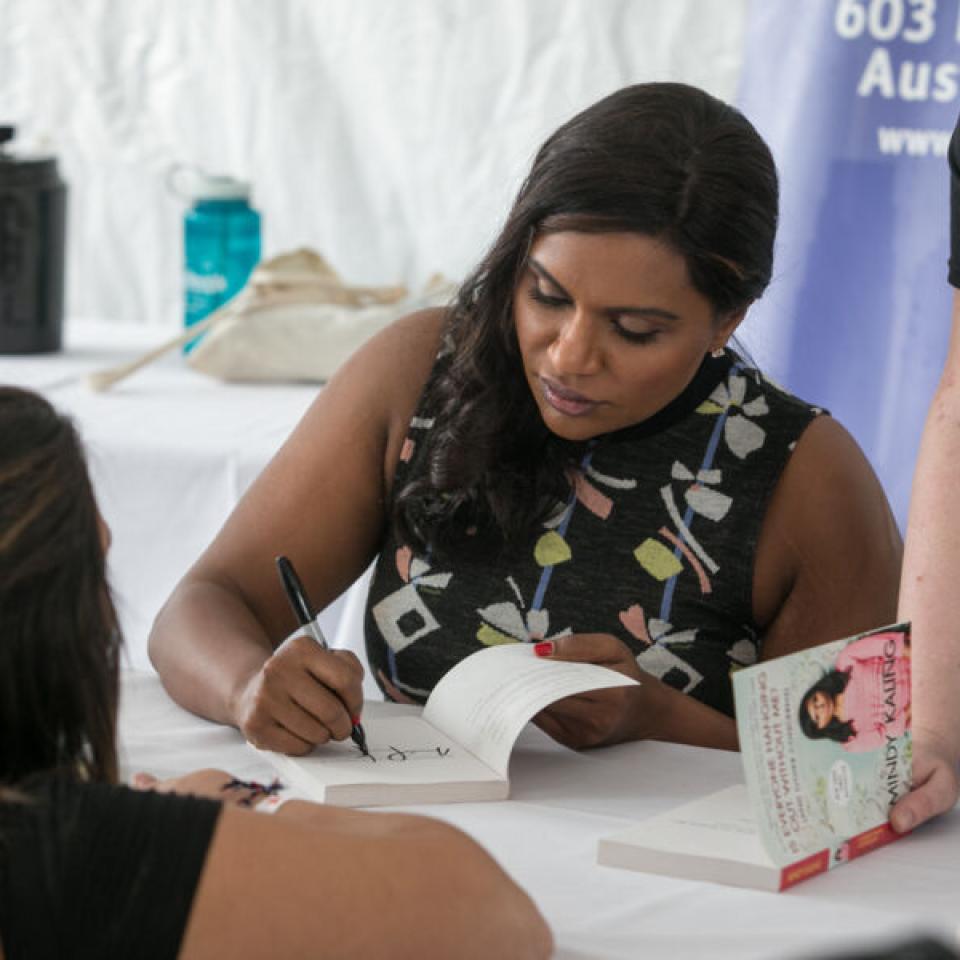 Mindy Kaling signing her book