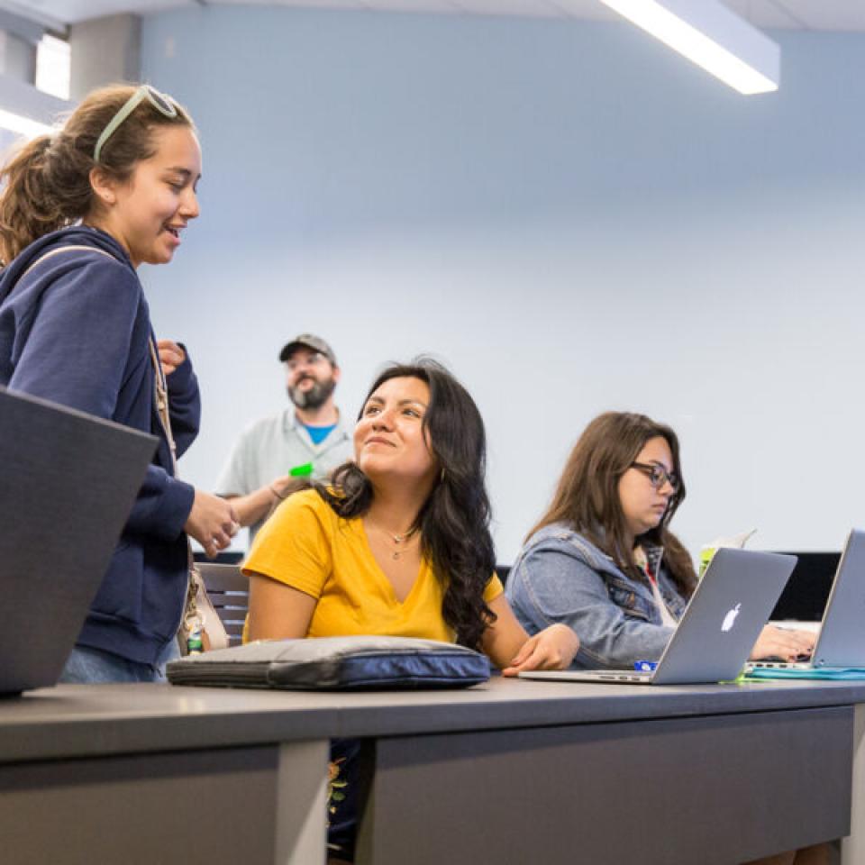 Johavana Avila chatting with a classmate