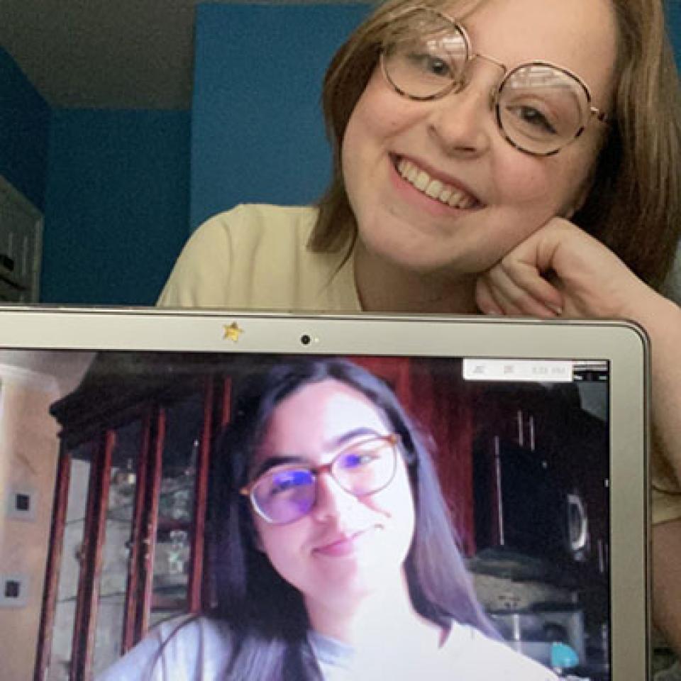 A selfie of Sammi and her Orientation Coordinator on the laptop on Zoom.