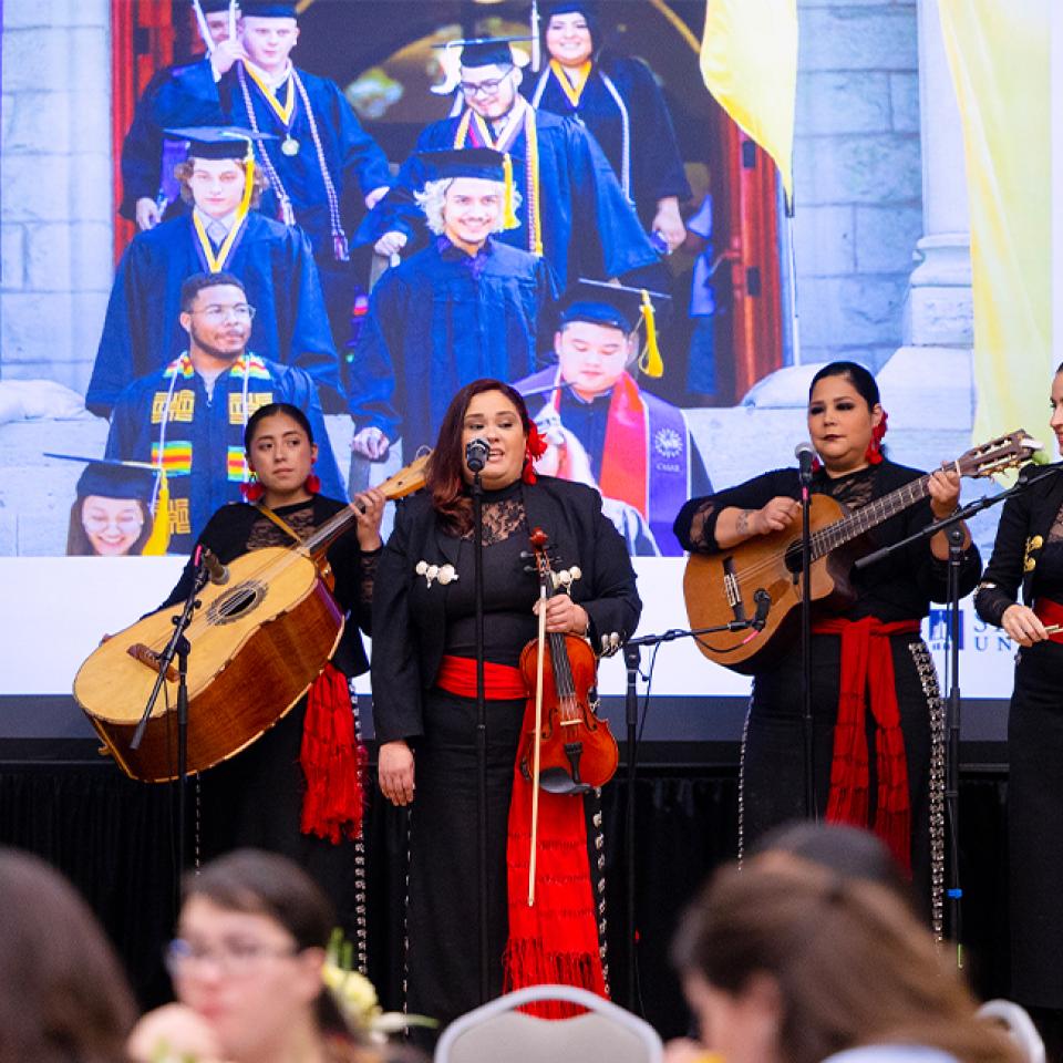 Women's mariachi performing for the CAMP 50th celebration