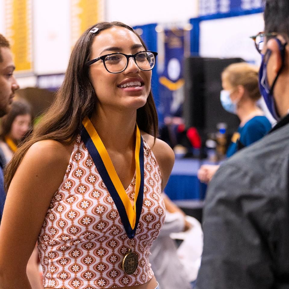 Student receives medallion at the Fall 2022 Medallion Ceremony