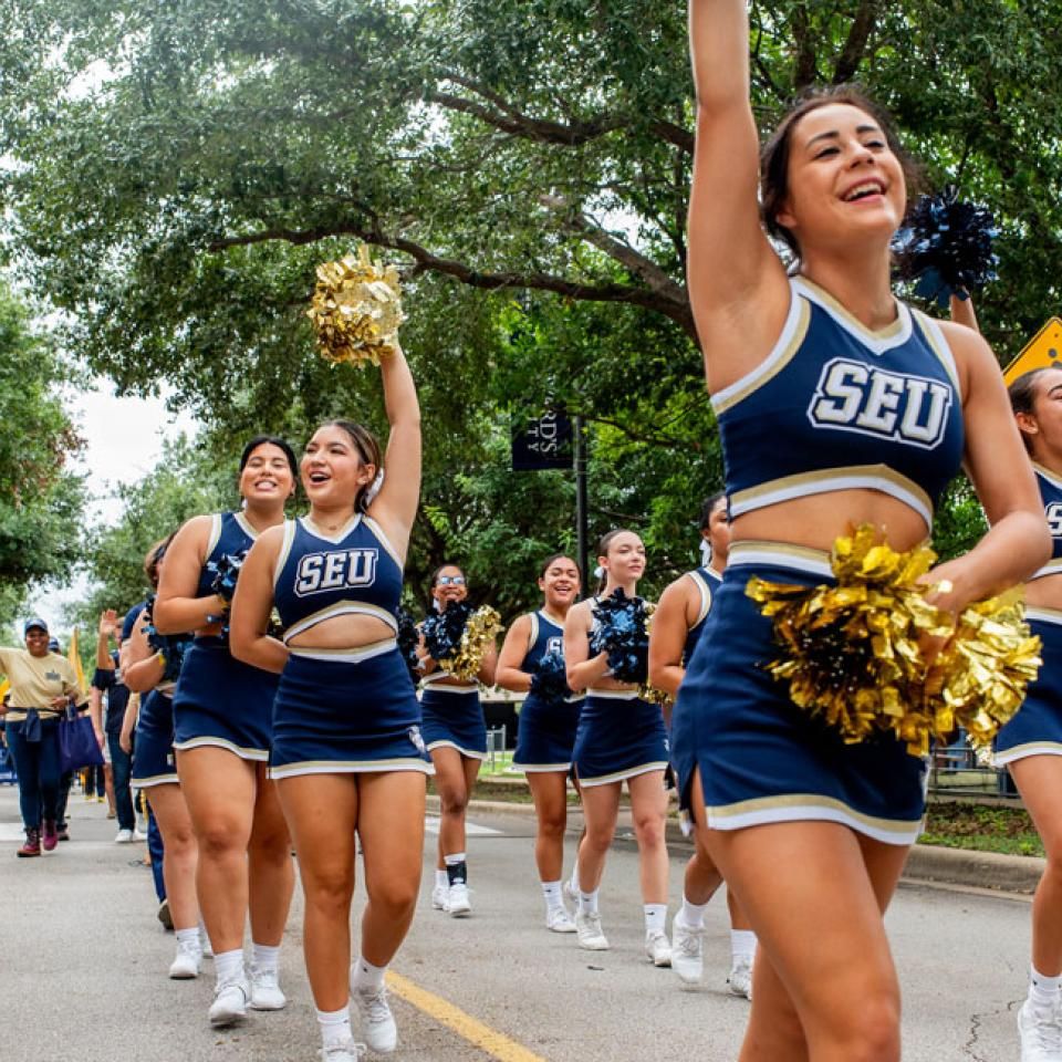 SEU cheer walking the homecoming parade