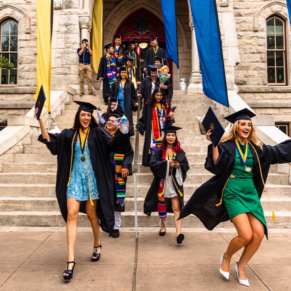 Spring Commencement 2023 graduates celebrating on the Main Building steps