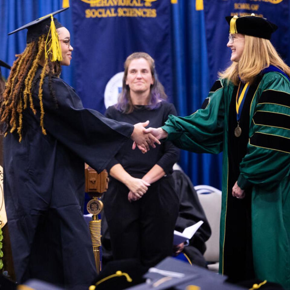 graduate shaking hands 