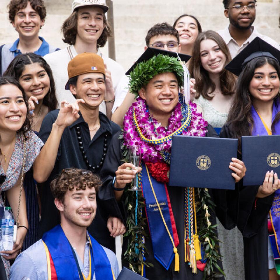 group of graduates posing for a photo