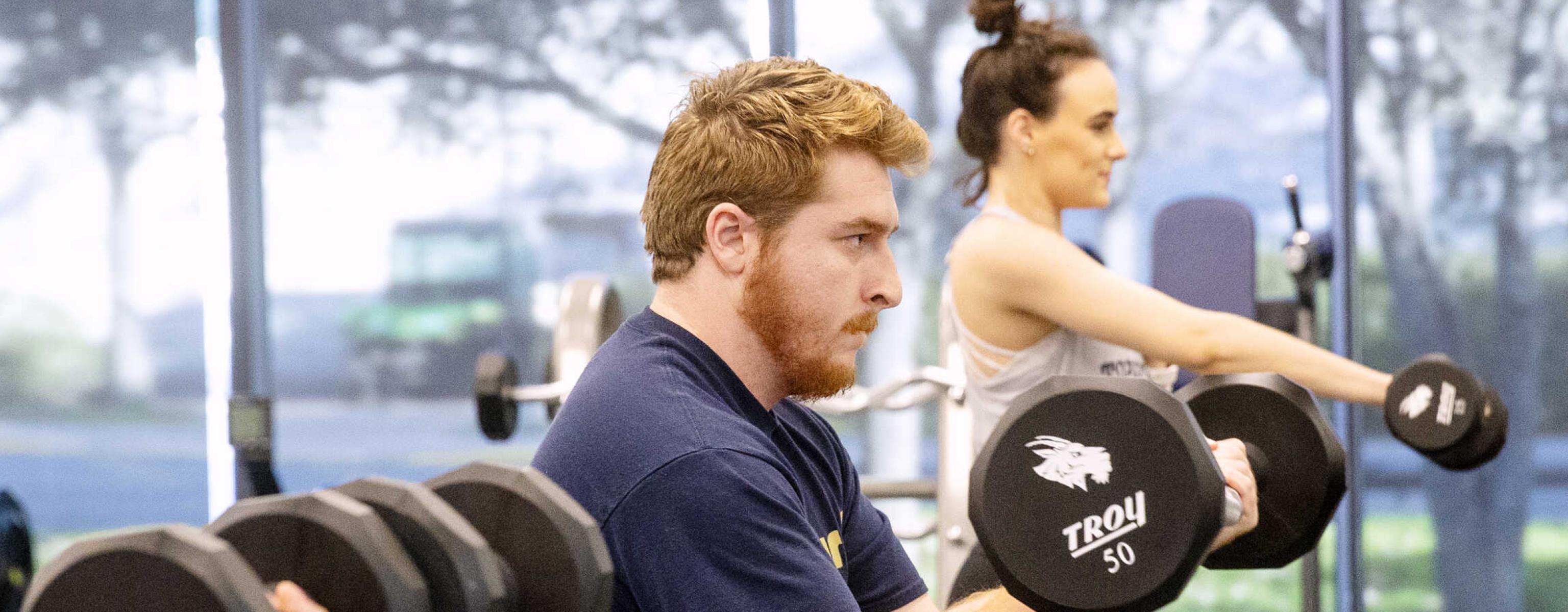 St. Edward's University students exercising in the Recreation and Athletic Center on campus