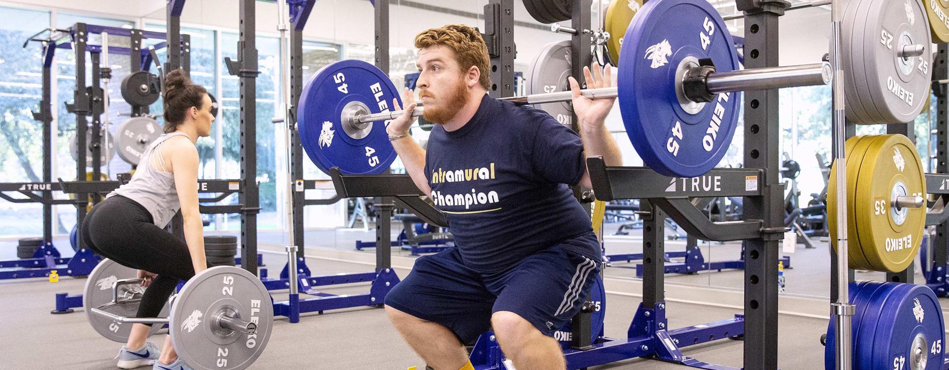 Student lifting weights in RAC