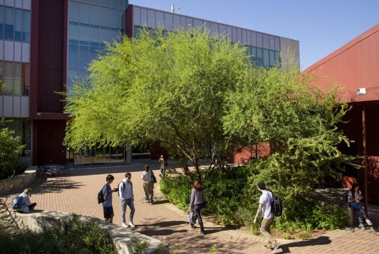 Students walk to and from classes outside of the John Brooks Williams Natural Sciences Center - South.