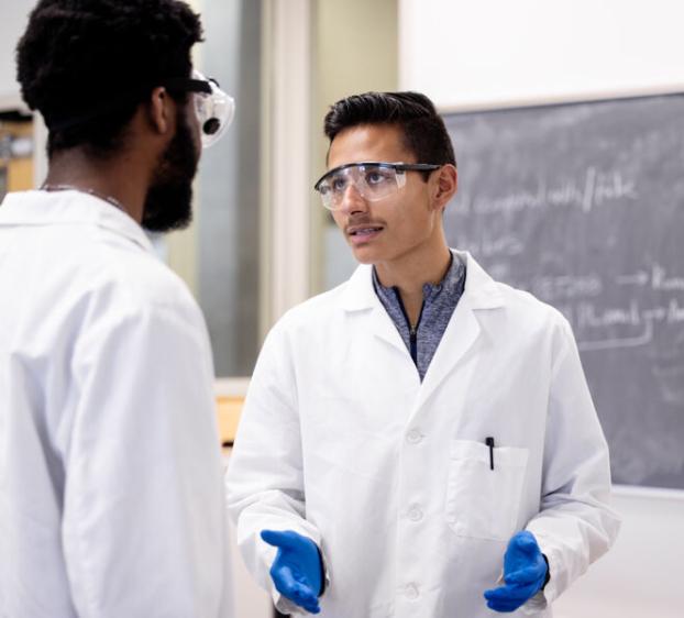 St. Edward's University faculty member instructing students in a lab