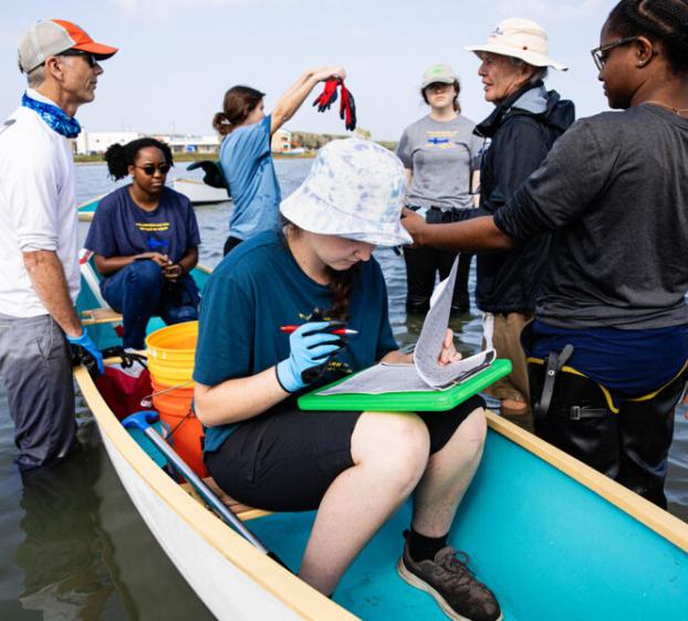 Student in an Ecology class conduct research on a port