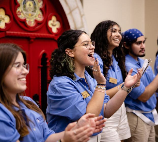 Orientation leaders cheering on students