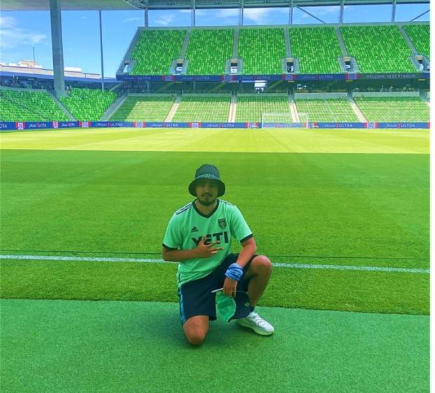 Ruben Valdovinos poses on the Austin FC field.