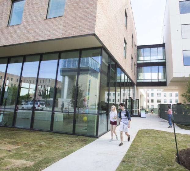 Students walking to St. André Apartments