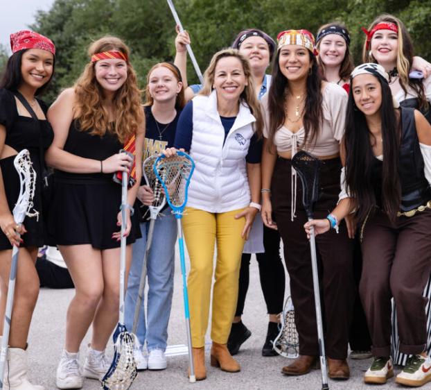 President Fuentes with the club sports women's lacrosse team