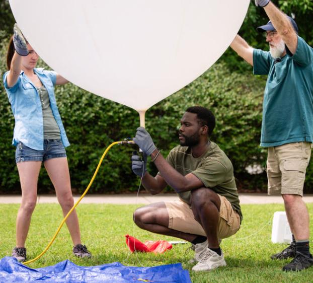 Students test a weather balloon to study ozone air quality in Austin