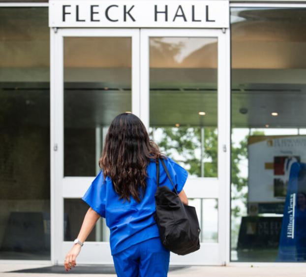 A St. Edward's nursing student enters Fleck Hall