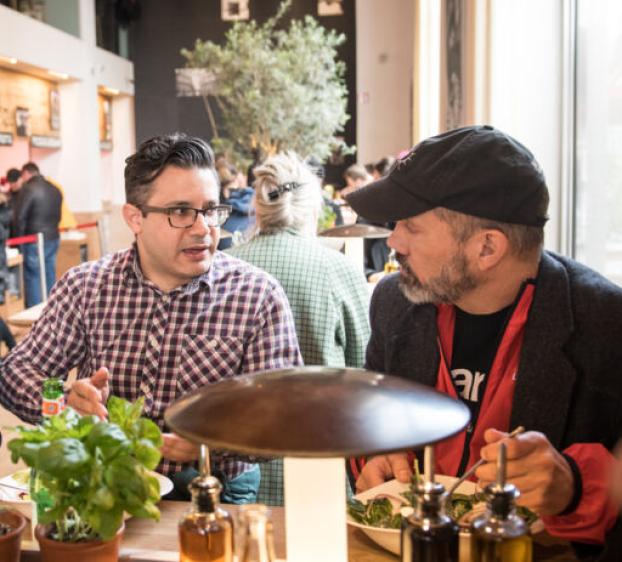 Alumni networking at a local café