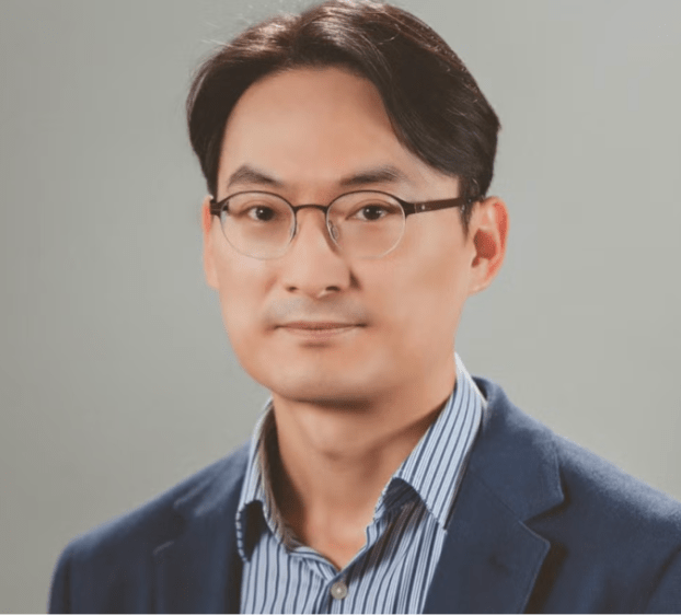 closeup of man with short hair and glasses