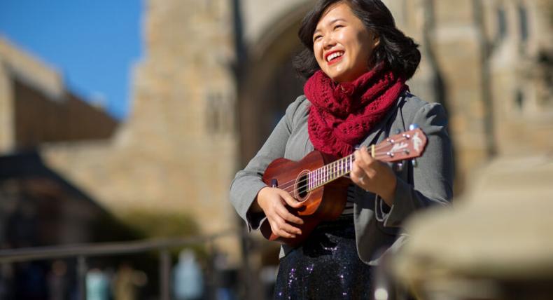 Amy Ontai plays the ukulele outside.