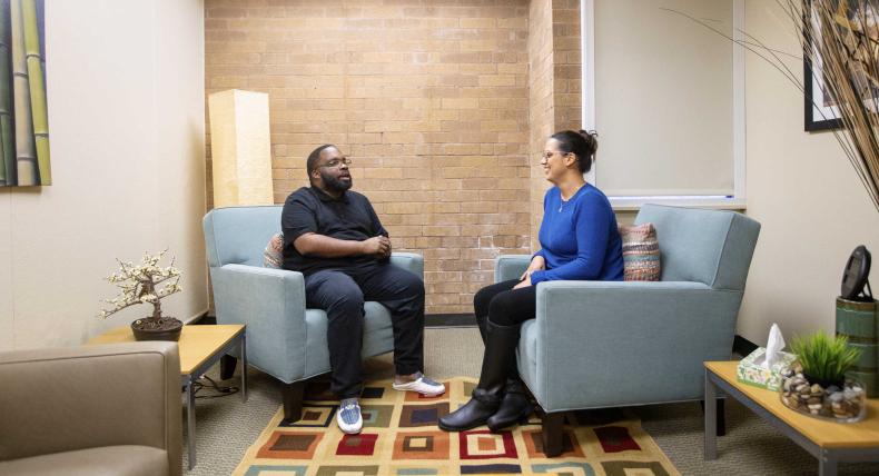 Counselor and patient chatting during a session