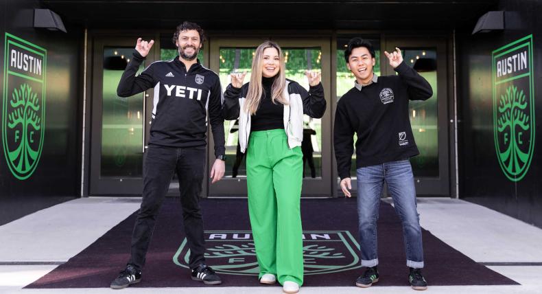 Tony Ho, Alfredo Naim and Emely Alvarado stand together outside of Q2 Stadium in Austin, Texas