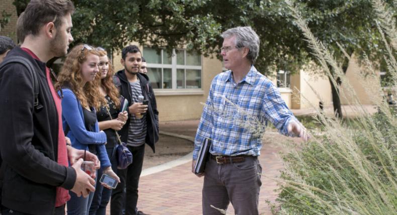 Bill Quinn teaching his students outdoors on campus