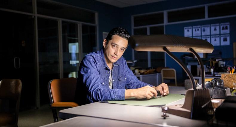 Gabriel Luna sitting at a desk