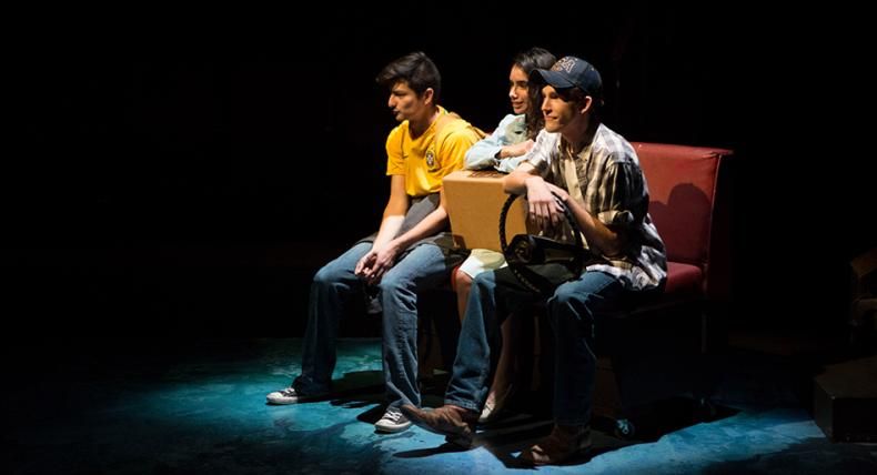 Three students act on the Mary Moody Northen Theatre stage in the play Anon(ymous).