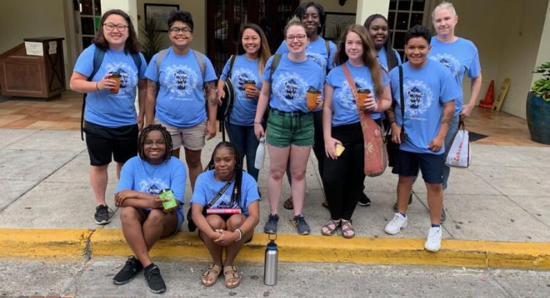 Sydney Mitchell, classmates and professor poses outside La Posada Hotel in Laredo, Texas, during their social justice journey.