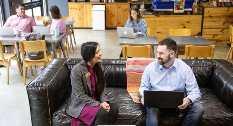 Student and a professor talking in a coffee shop