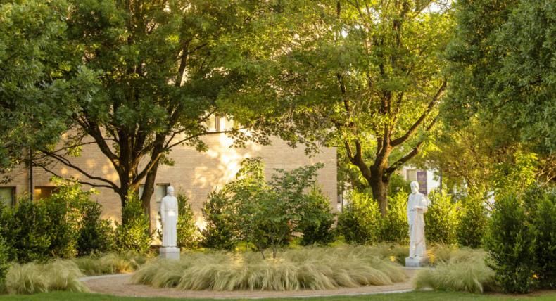 photo of trees on campus and religious statues