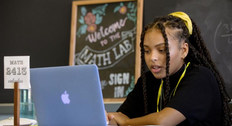 Taylor Huey prepares to mentor students in the Math Lab