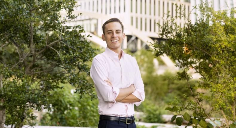 Finance major Christoph Hoermann ’21 poses for a photo in Austin's downtown business district.