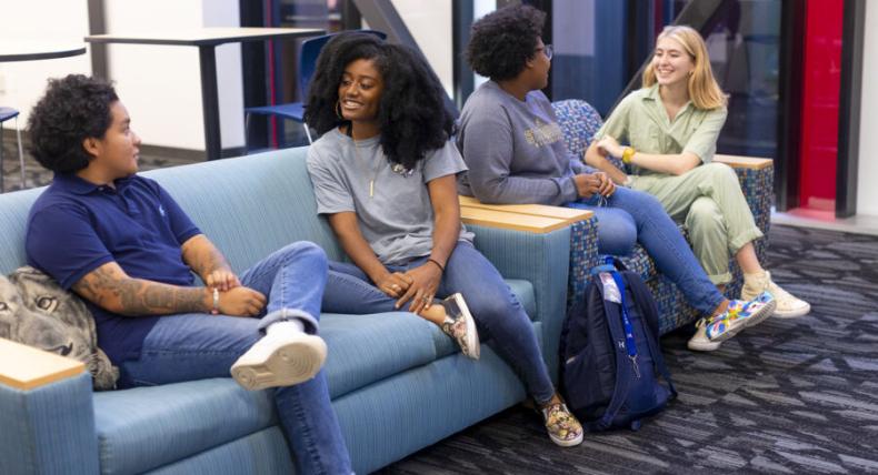 Students at St. Edward's socializing in the lobby of the Residential Village