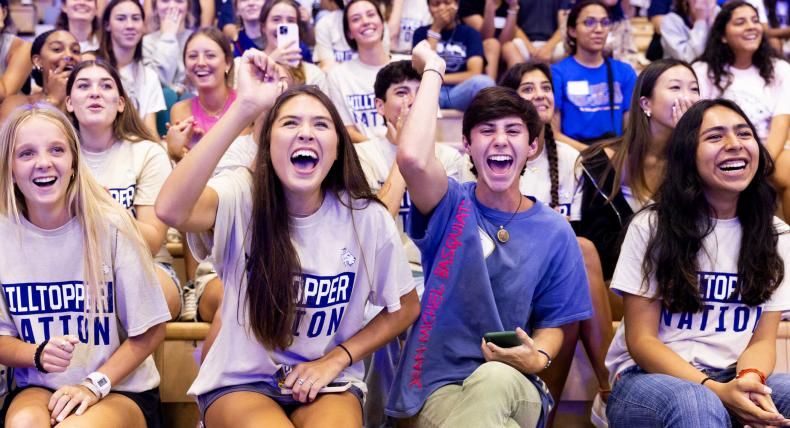 Students cheering during Anchor pep rally at St. Edward's