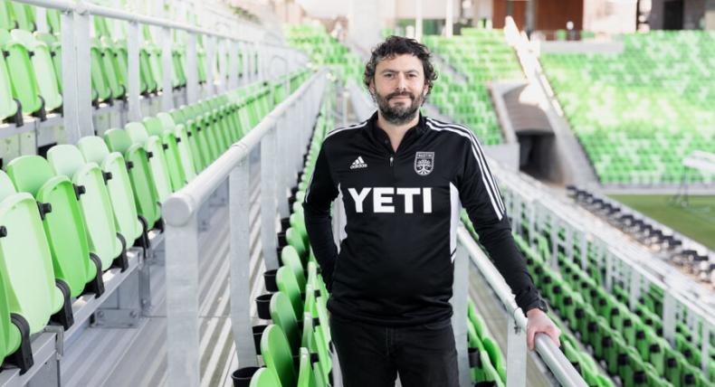 Alfredo Naim '07 smiles for a photo inside Austin FC Stadium.