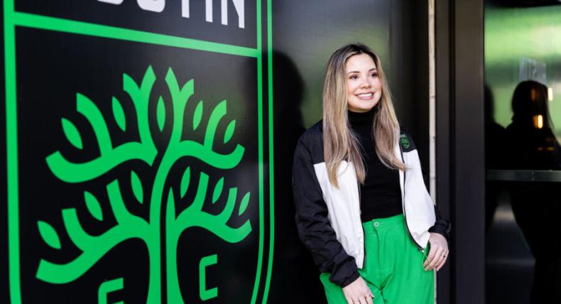 Emely Alvarado '21 poses for a photo in front of Austin FC Stadium.